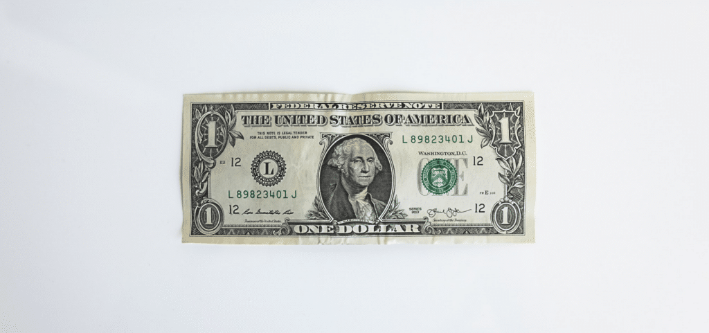 One dollar bill, illustrating the $1 upselling strategy