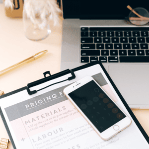 Pricing page next to a phone and computer