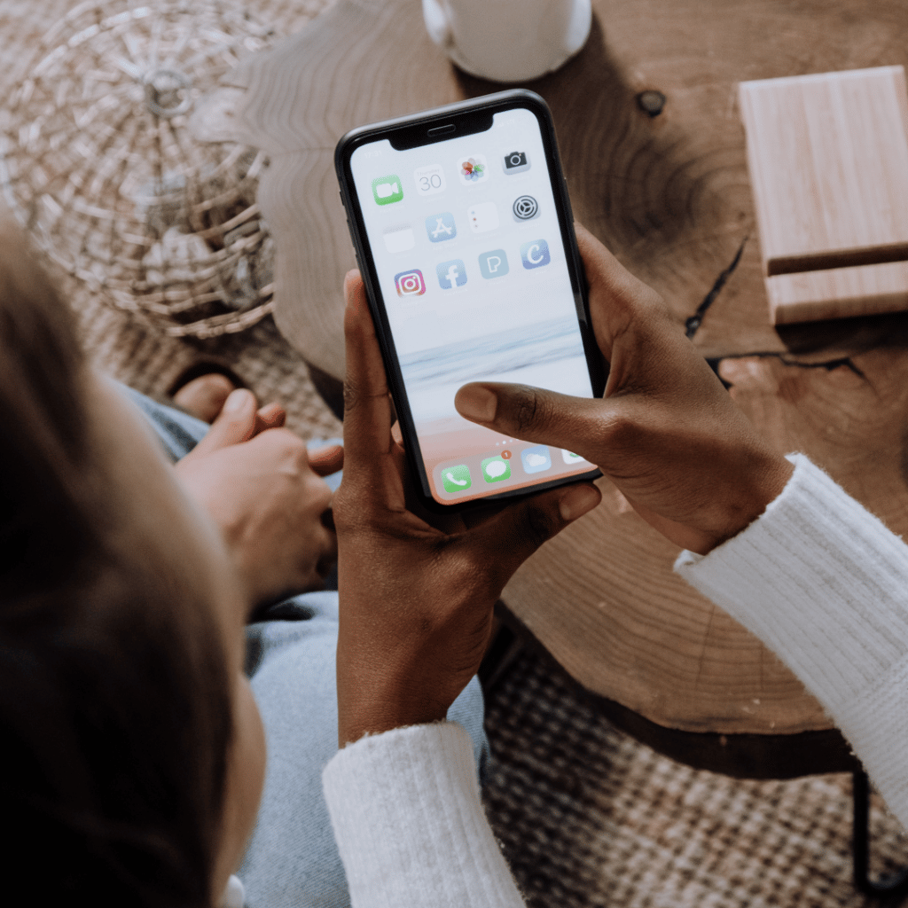 Person scrolling through content on smartphone